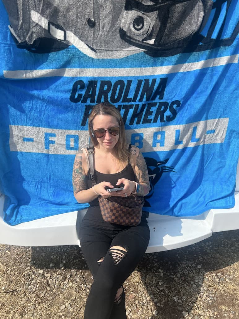 Carolina Panthers tailgate party with Prestige Worldwide party bus and game-day setup in Charlotte
