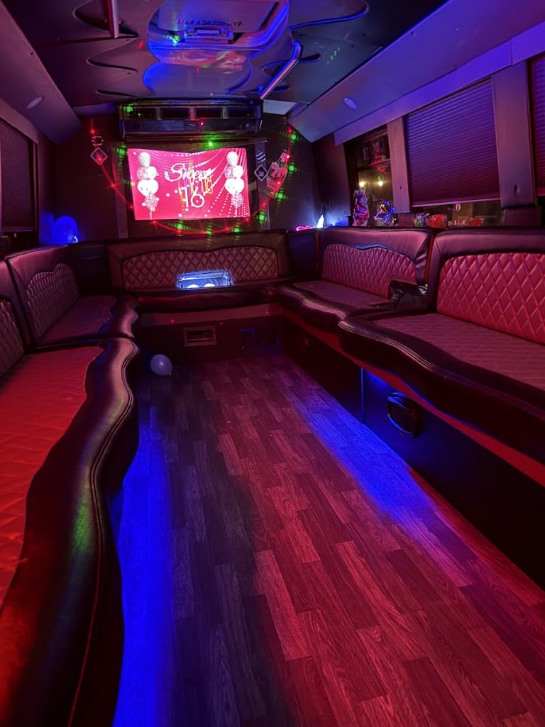 Prestige Worldwide Charlotte party bus at night with LED lounge lighting